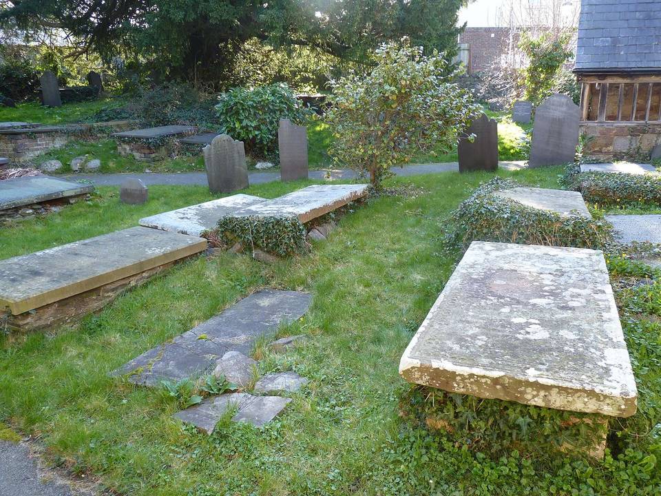 Some very old slab gravestones in the cemetery at St. Benedict's Church, Gyffin