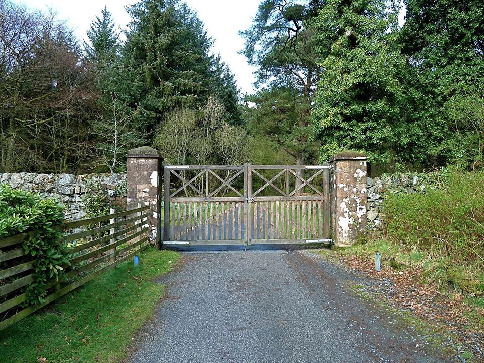 Gated entrance to Knockman Wood, Galloway