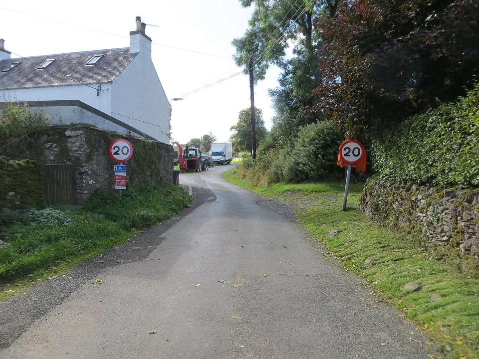 Minor road about to join the B6453 road in Midlem