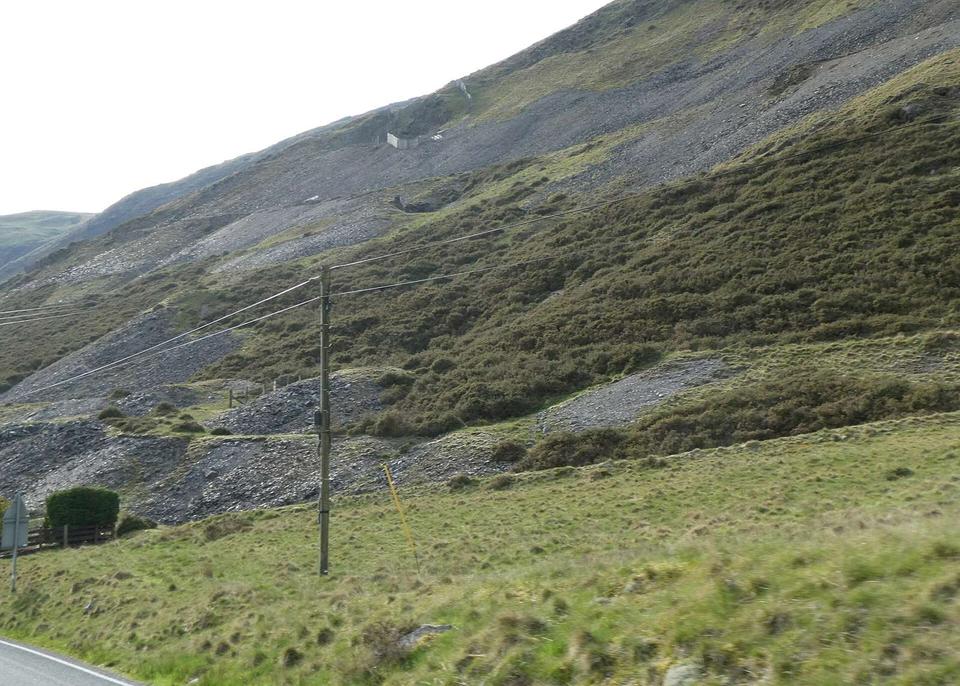 A hillside covered with mine spoil, overlooking Afon Ystwyth