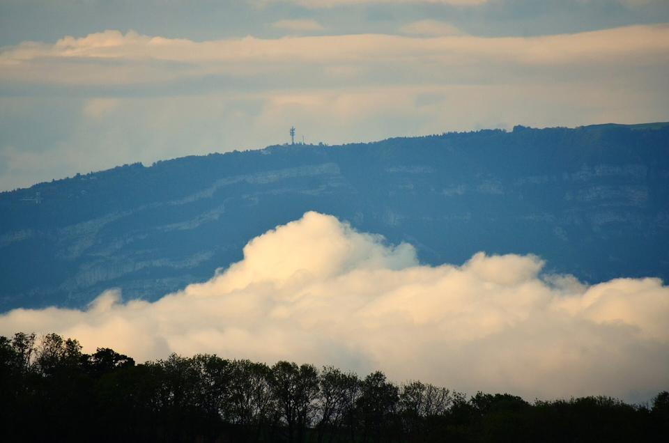 Clouds in the Lac Léman valley and the telecom tower at Mont Saleve 1287 m heigth