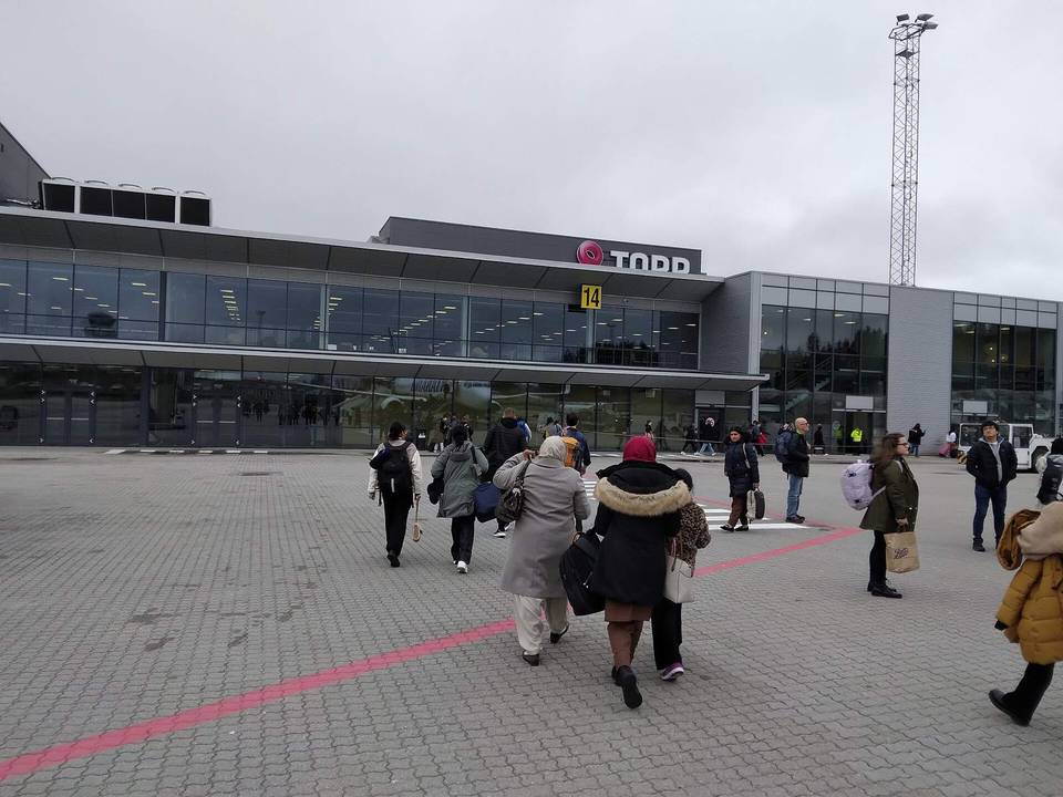 Passengers walking into Sandefjord Airport, Torp off a plane which has just landed from Manchester