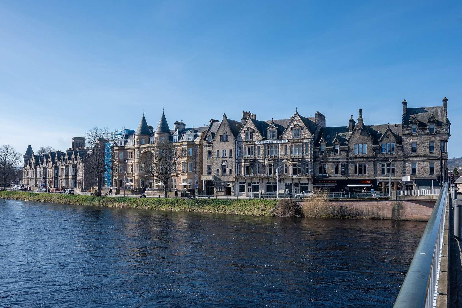 The Ness Walk Street, as seen from Ness Bridge. The walk has several old buildings along it.