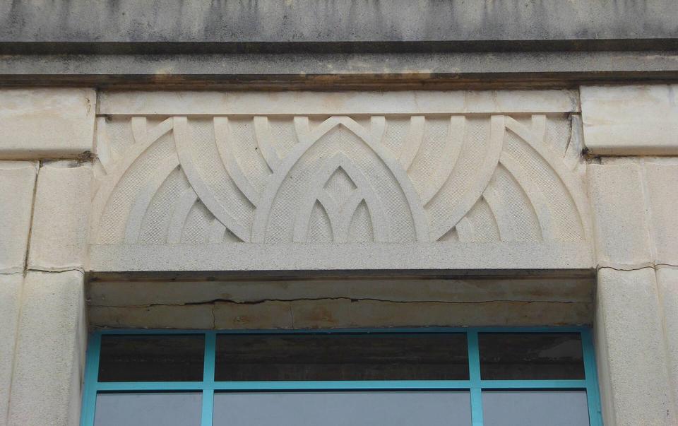 Stonework detail on the exterior of Burton's art deco shop, Abergavenny.