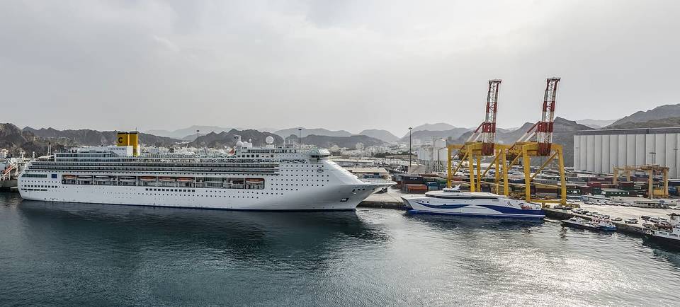 Costa Victoria and the surrounding Port Sultan Qaboos in Muscat, Oman as seen from another cruise ship