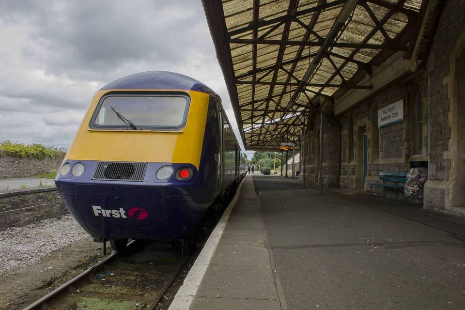 Great Western Railway's 1B15 0845 service from London Paddington stands at Pembroke Dock, shortly after arrival on Saturday 23rd July 2016. Power car 43040 is nearest the camera. The train will return