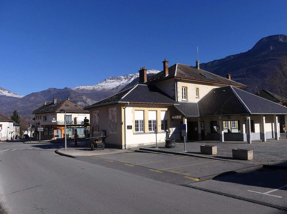 Sight, in autumn, of Saint-Étienne-de-Cuines village and town hall, Maurienne valley, Savoie, France.