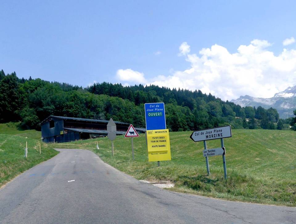 Sight, in summer, of the sign displaying 'open' the road leading to Col de Joux-Plane pass, on the heights of Samoëns, Haute-Savoie, France.