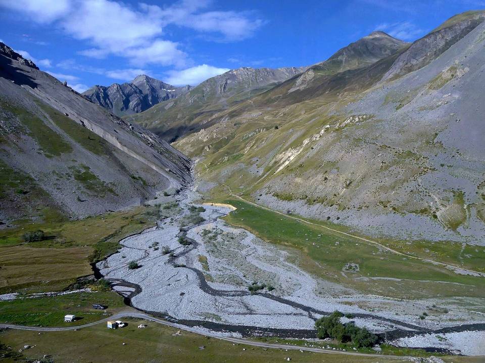 Sight of Combe de Mortavieille valley and Lauzette river (ahead) flowing into Valloirette river, between Valloire and col du Galibier pass, in Savoie, France.